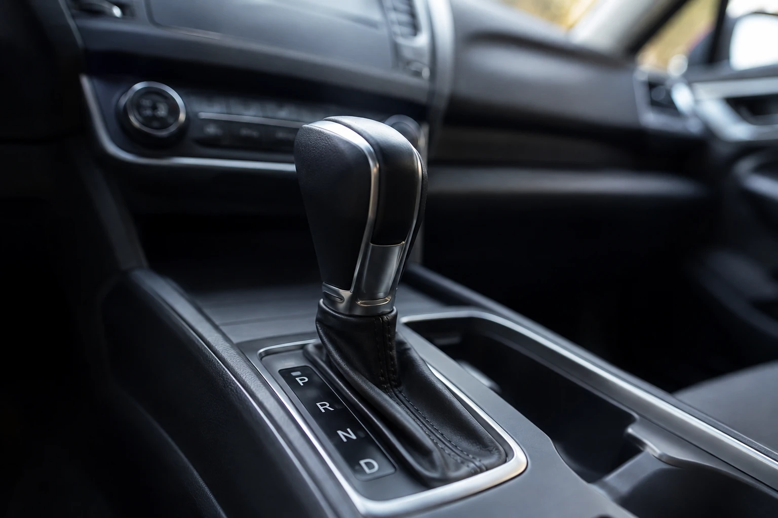 The gear selector of an automatic car with the park, reverse, neutral and drive positions marked