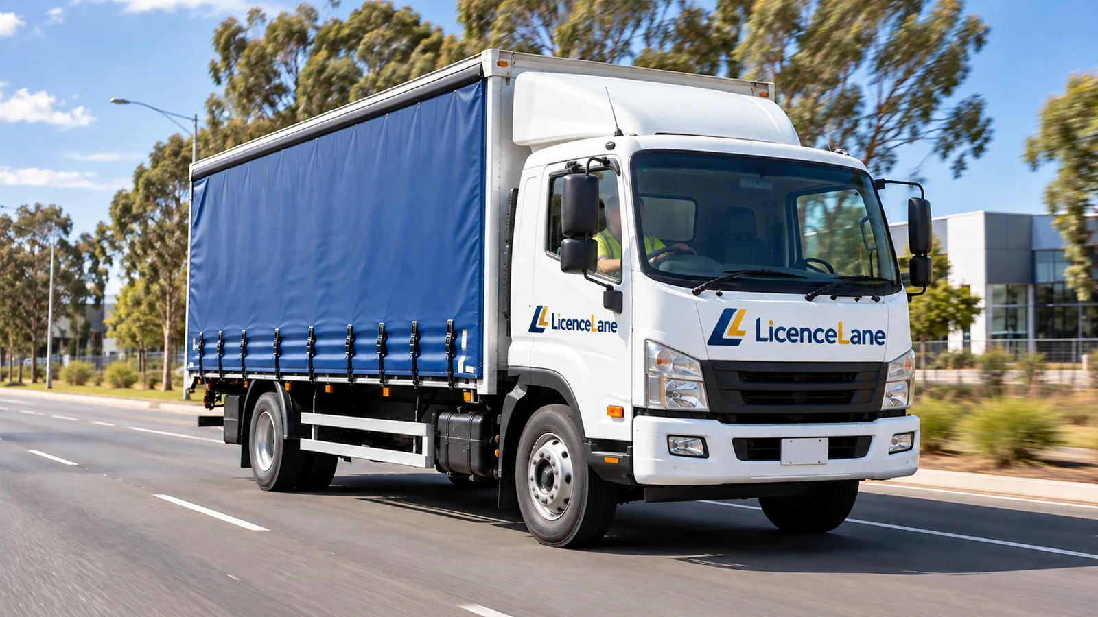 A two-axle truck with a blue curtainsider body and LicenceLane logos on its cab.